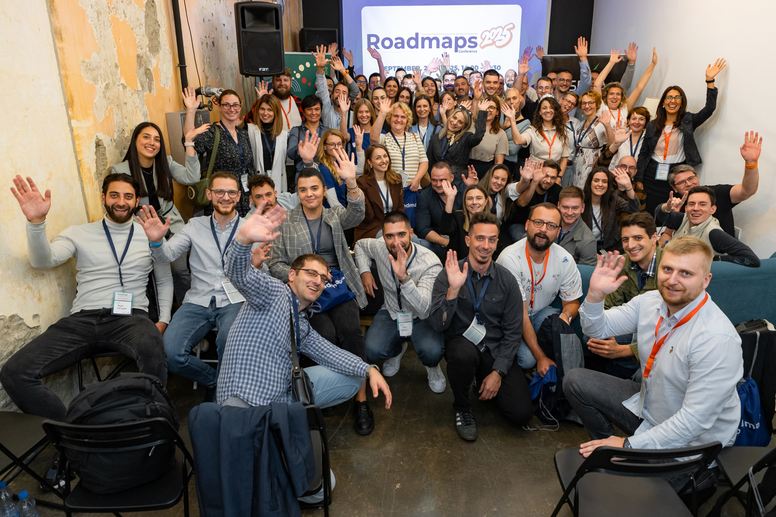 Roadmaps 2025 attendees posing together with raised hands at ICT Hub Belgrade